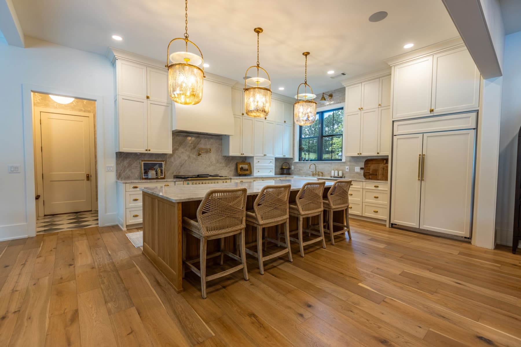 Kitchen with hardwood floors and pendant lighting